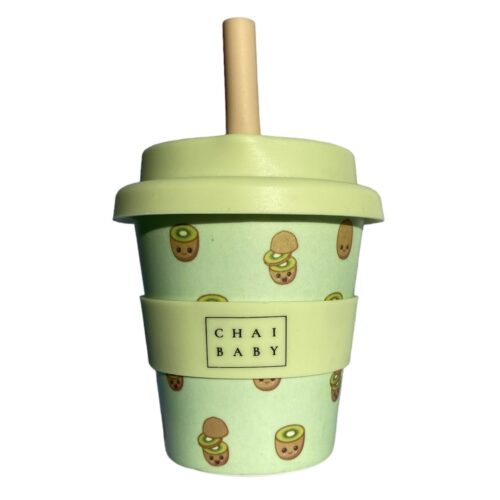 Green babayccino and fluffy cup with kiwifruits on it. silicone band, lid and straw