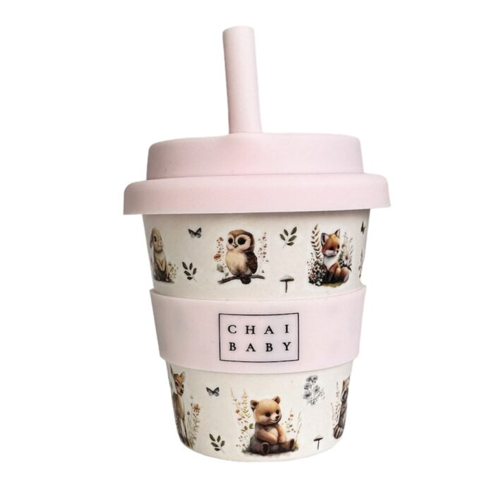 A babyccino, fluffy keep cup with a woodlands print on it with pale pink lid, band and straw