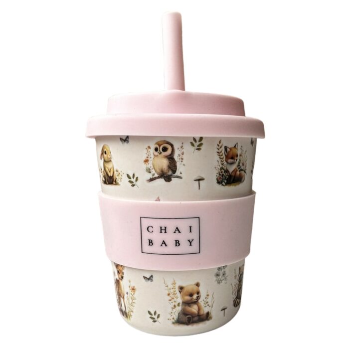 Woodlands keep cup with silicone lid and band 120ml with baby animals on it, bunny, owl, fox, bear, fawn and mushrooms and butterflies and flowers with baby pink background and baby pink straw designed in central Otago New Zealand